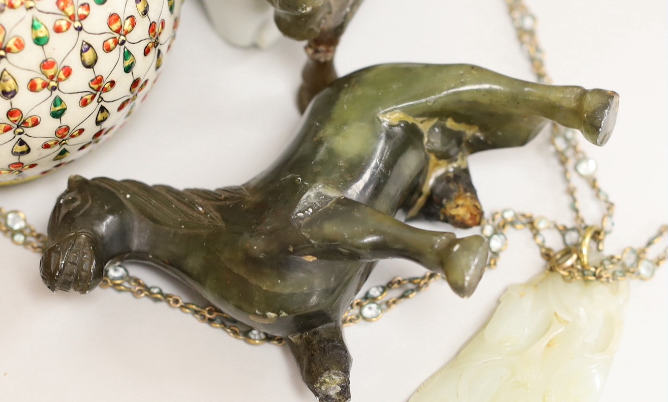 A 19th century Chinese pale celadon jade pendant a Chinese blanc de Chine figure, two soapstone horses and an Indian vase, figure 17cms high